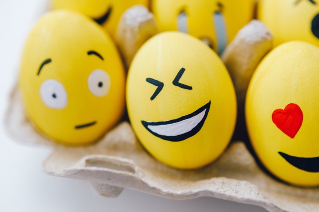 Yellow eggs with emoji faces of surprised, laughing, in love - Aloha At Home Eco-Map of Family Supports