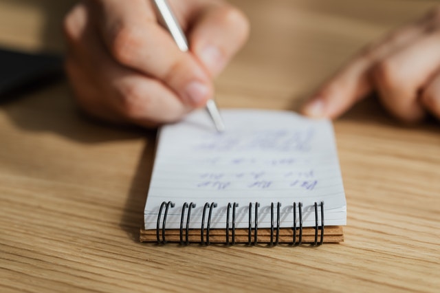 Aloha at Home Parent or Caregiver writing down times when he is stressed and how to plan for it